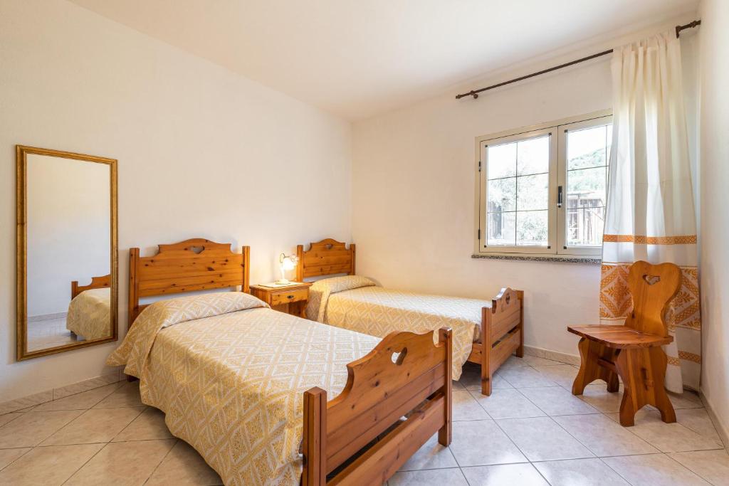 Posteľ alebo postele v izbe v ubytovaní Appartamento in Villa Gelsomino