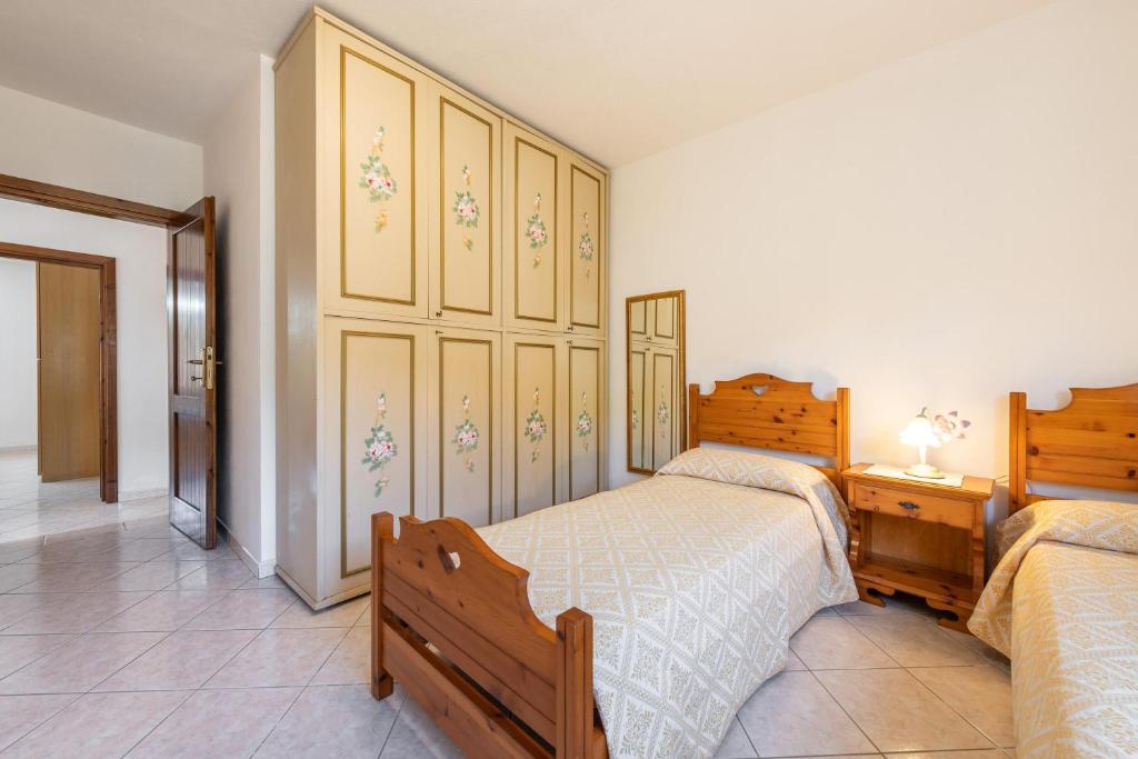 Posteľ alebo postele v izbe v ubytovaní Appartamento in Villa Gelsomino