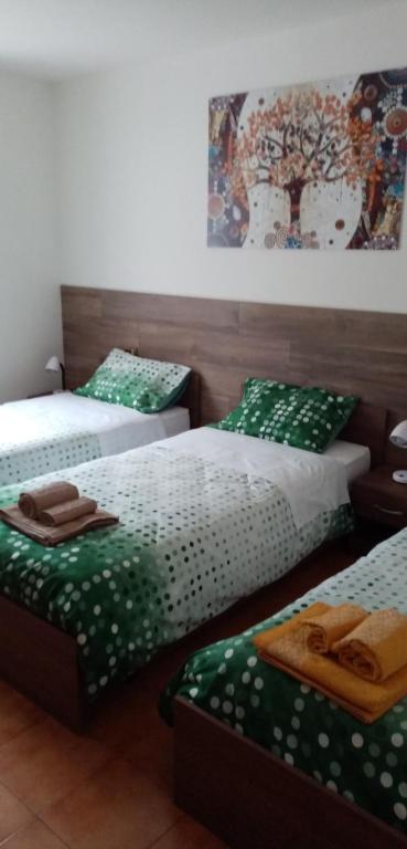 A bed or beds in a room at Al Portec