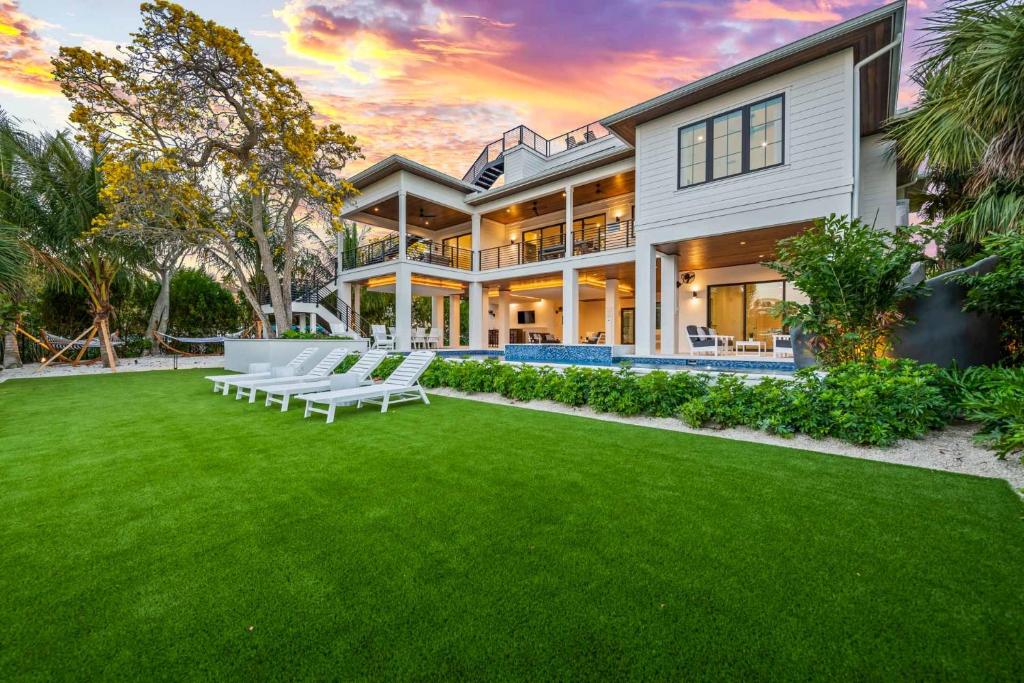 a large house with a lawn in front of it at The Ringling Estate in Sarasota