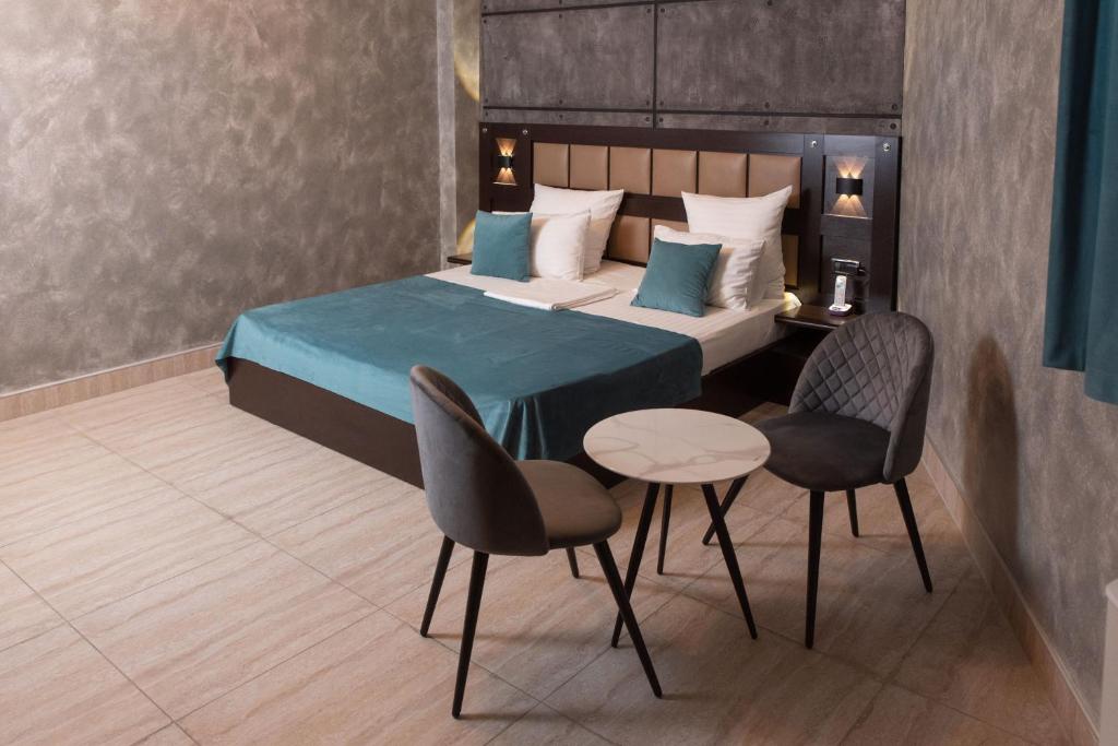 Postel nebo postele na pokoji v ubytování Avan Plaza Hotel