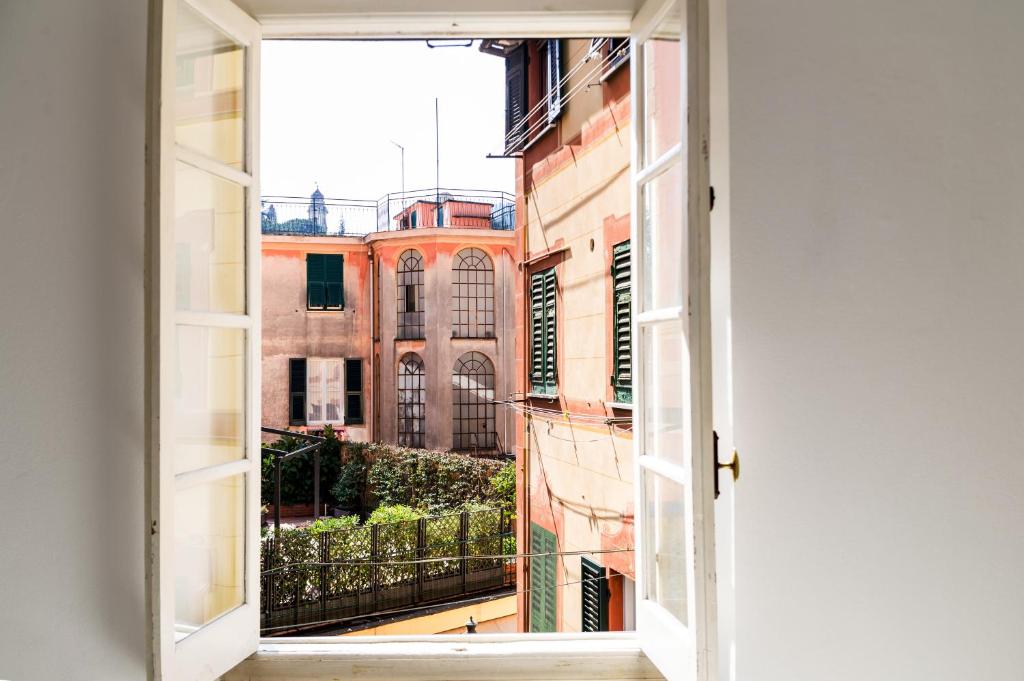 an open window with a view of a building at Nel Cuore di Santa in Santa Margherita Ligure