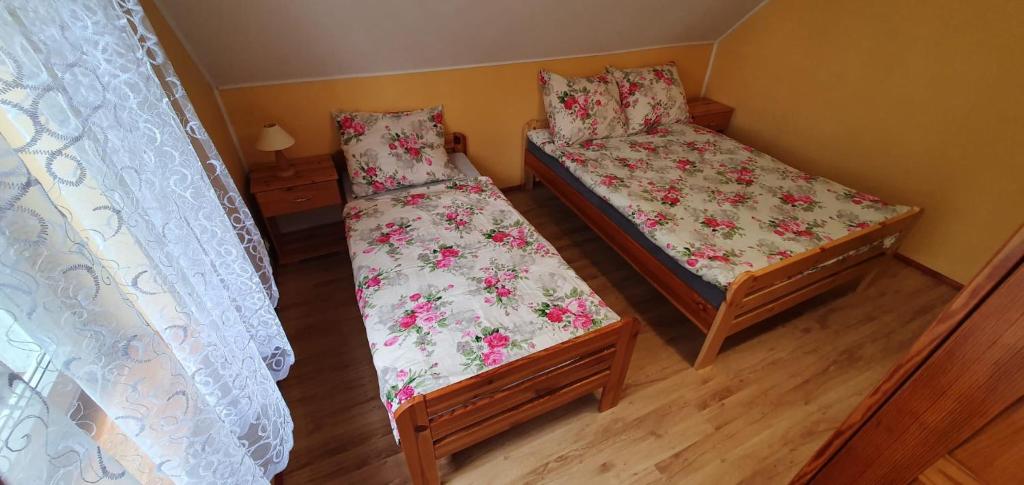Posteľ alebo postele v izbe v ubytovaní Przystanek Mazury