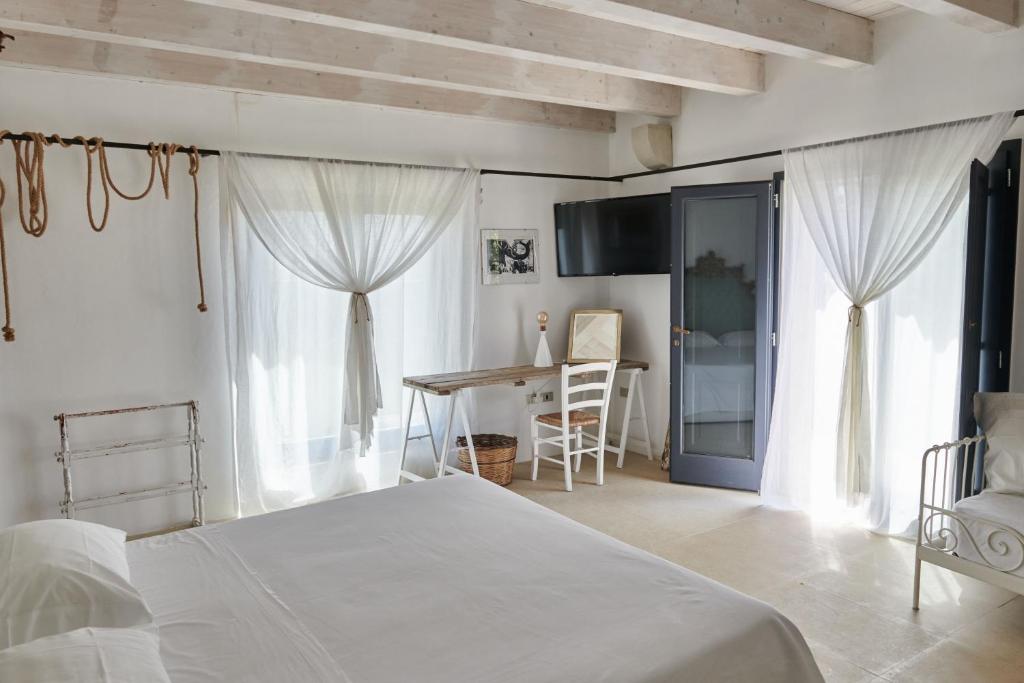 Postel nebo postele na pokoji v ubytování Masseria Prosperi