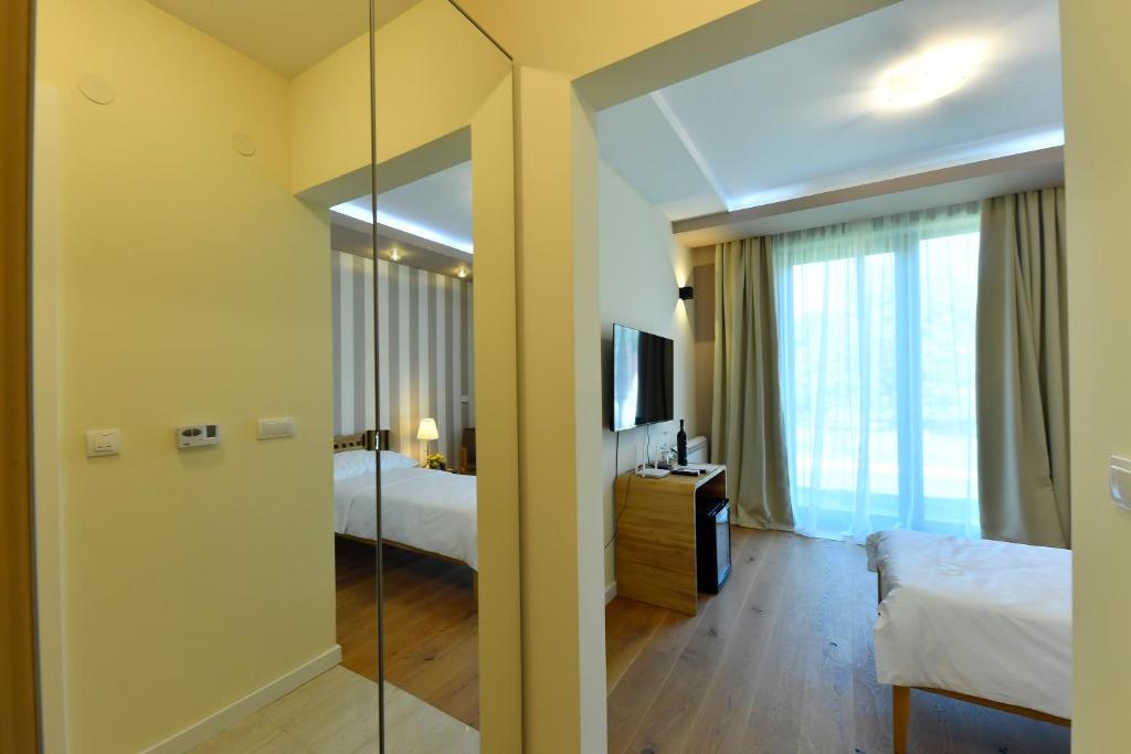 Postel nebo postele na pokoji v ubytování Villa Luxury Rooms - Wine Resort