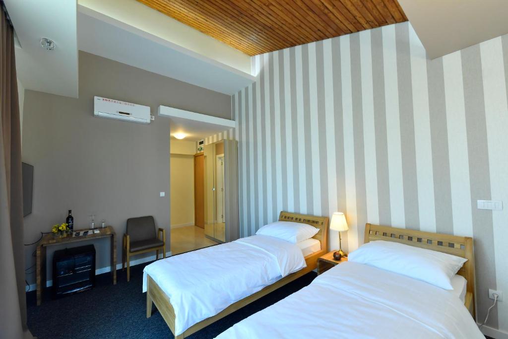 Postel nebo postele na pokoji v ubytování Villa Luxury Rooms - Wine Resort