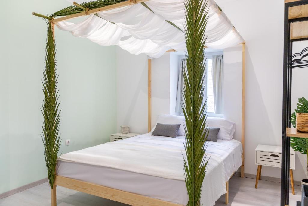 Postel nebo postele na pokoji v ubytování Boho Boutique Corfu