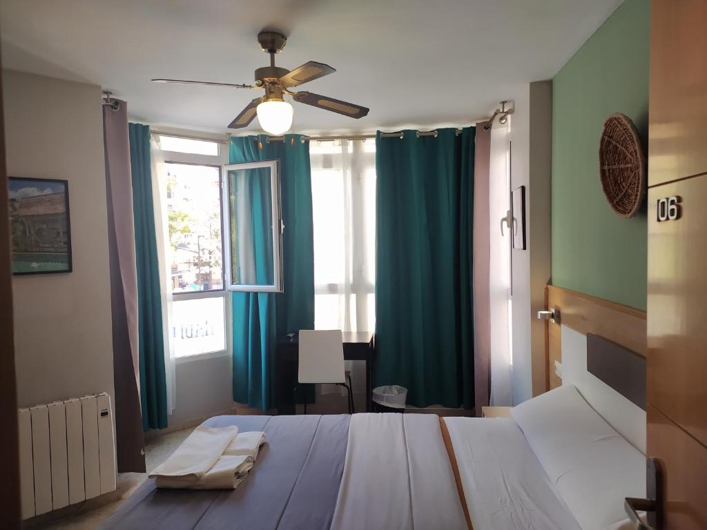 Postel nebo postele na pokoji v ubytování Habitaciones Barra89