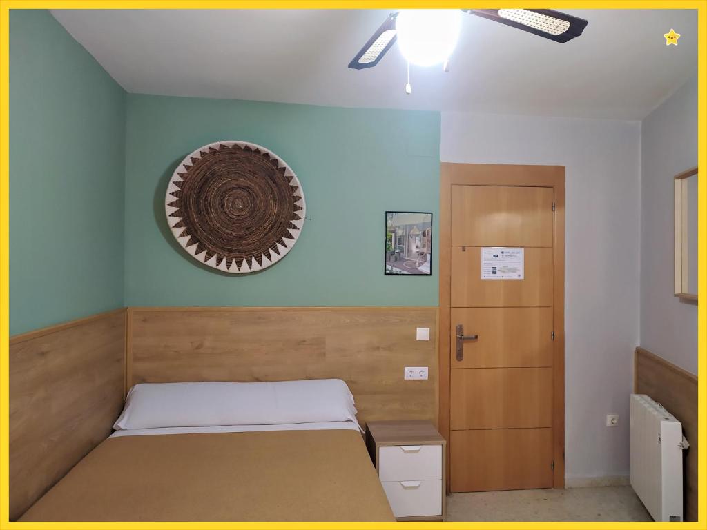 Postel nebo postele na pokoji v ubytování Habitaciones Barra89