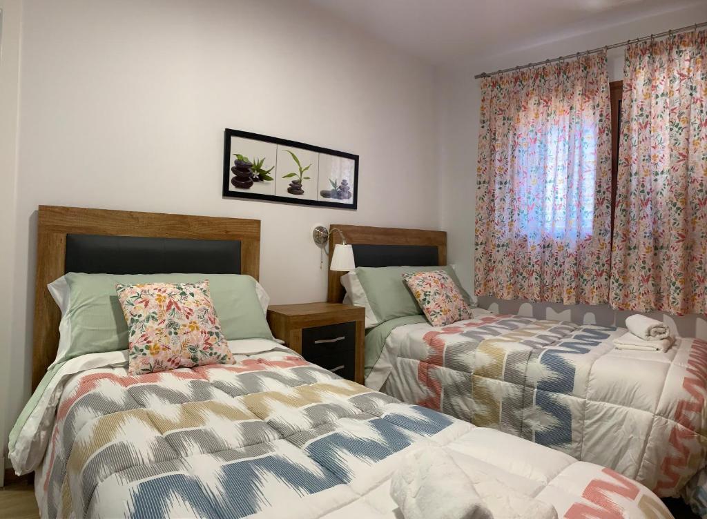 Un pat sau paturi într-o cameră la Apartamento La Solanita, Artenara