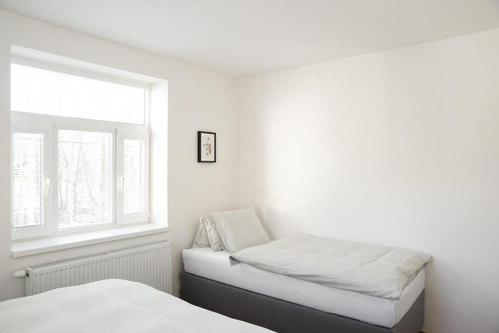 Postel nebo postele na pokoji v ubytování Apartmány Winkler
