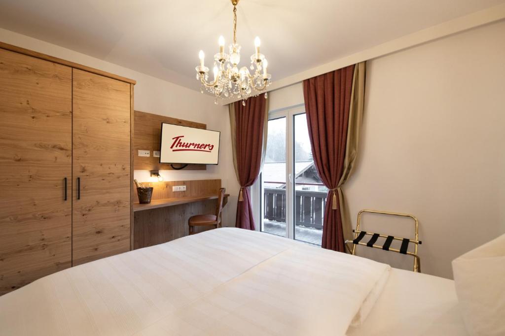 Postel nebo postele na pokoji v ubytování Thurners Boutique Hotel