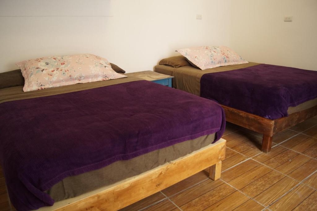 Postel nebo postele na pokoji v ubytování Catre de mi corazón