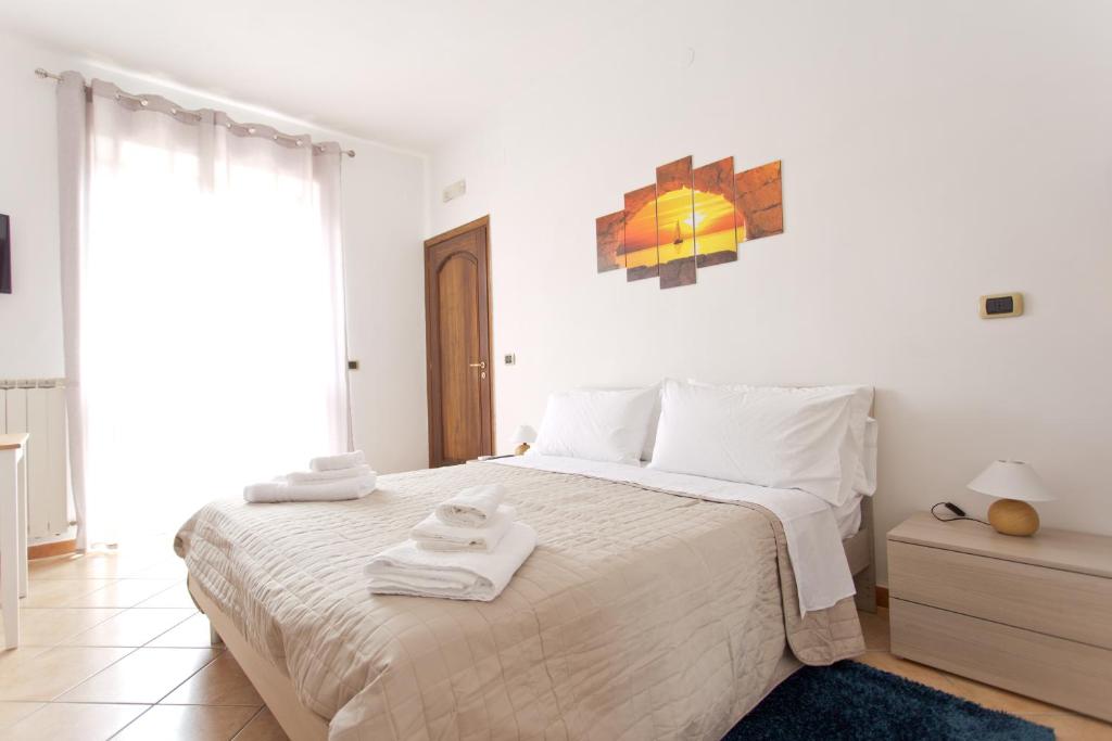 A bed or beds in a room at La Villa Carmelina