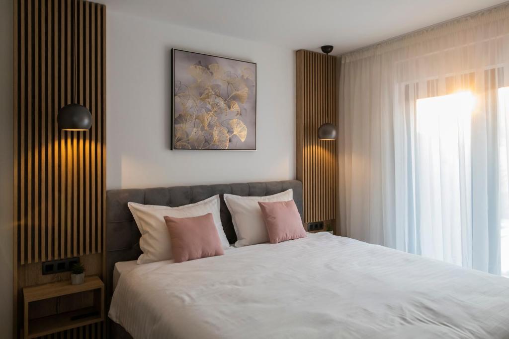 Postel nebo postele na pokoji v ubytování Villa Magna luxury apartments