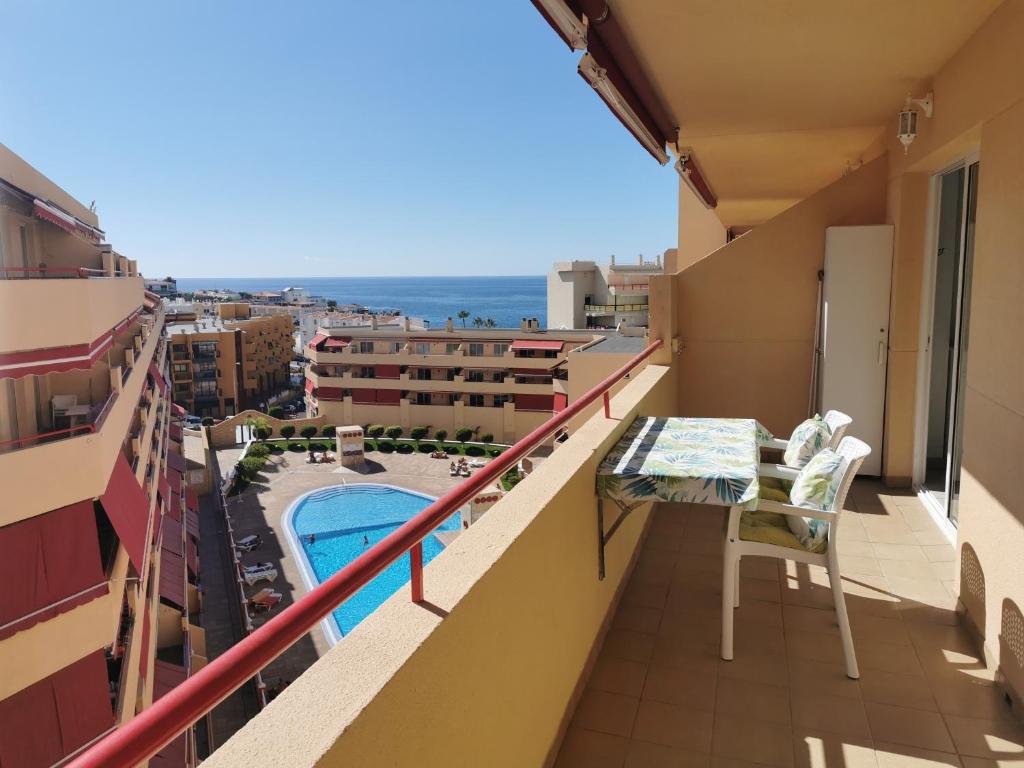 a balcony with a view of a swimming pool at Apartment Puerto de Santiago in Puerto de Santiago