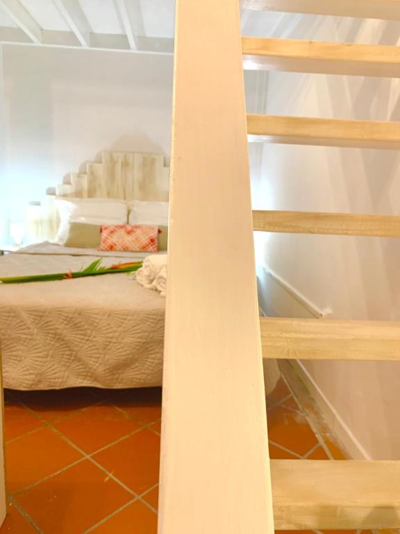 Uma cama ou camas num quarto em SOMPTUEUX DUPLEX SUR LA ROUTE DES PLAGES