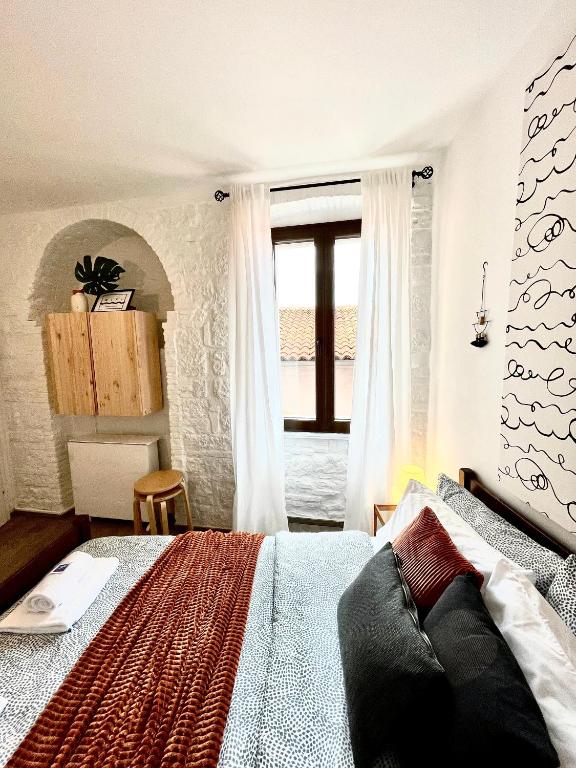 Postel nebo postele na pokoji v ubytování Rooms & Apartments La Casa di Loreto