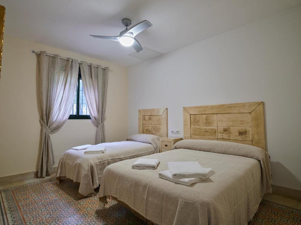 Posteľ alebo postele v izbe v ubytovaní VILLA BASILIO