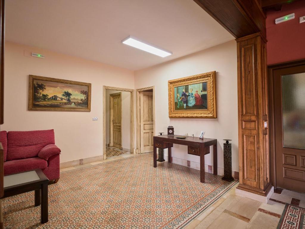 Televízia a/alebo spoločenská miestnosť v ubytovaní VILLA BASILIO