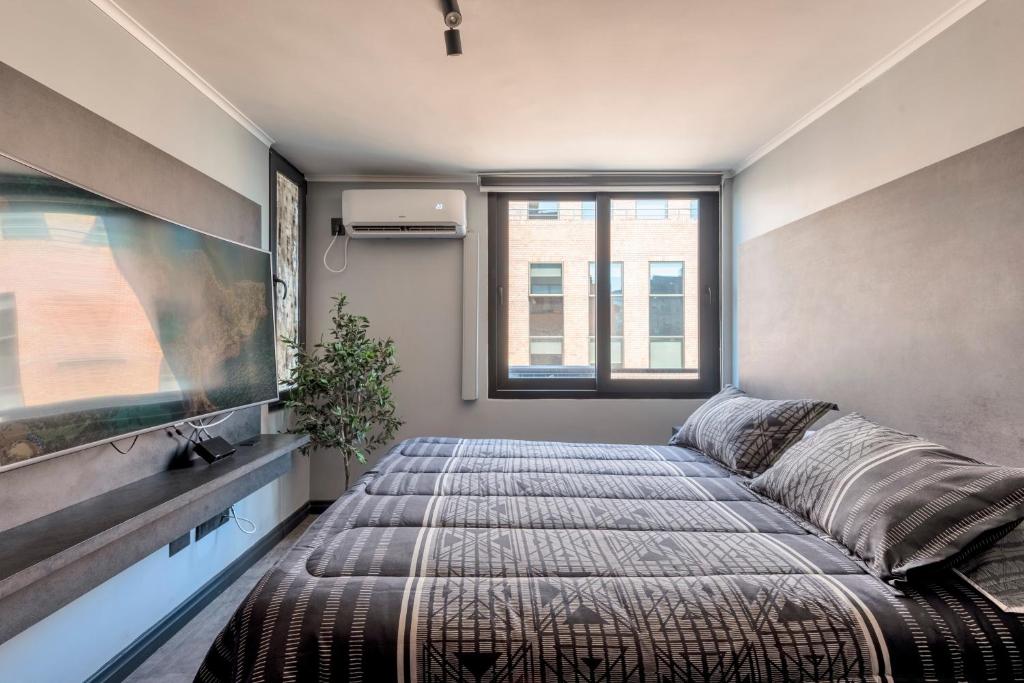 Postel nebo postele na pokoji v ubytování Design Tech Comfort & Location