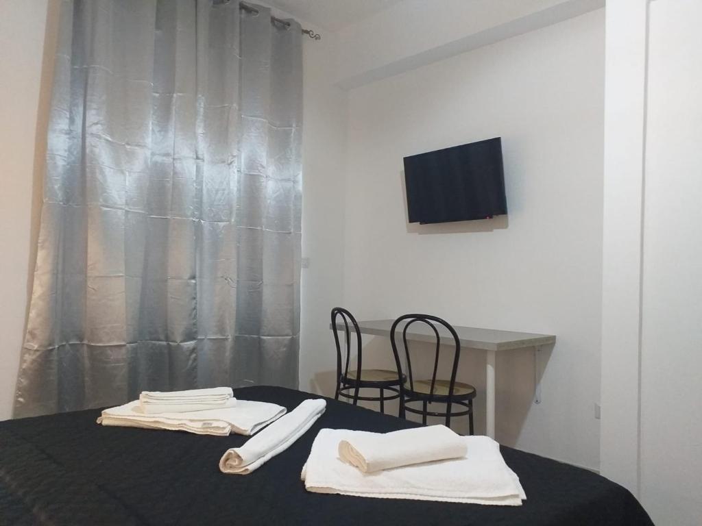 TV a/nebo společenská místnost v ubytování BERNINI Affittacamere - Guest House