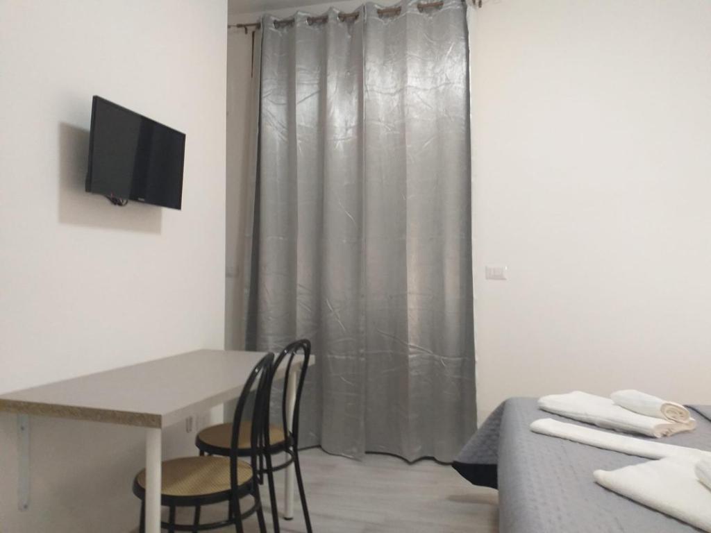 TV a/nebo společenská místnost v ubytování BERNINI Affittacamere - Guest House