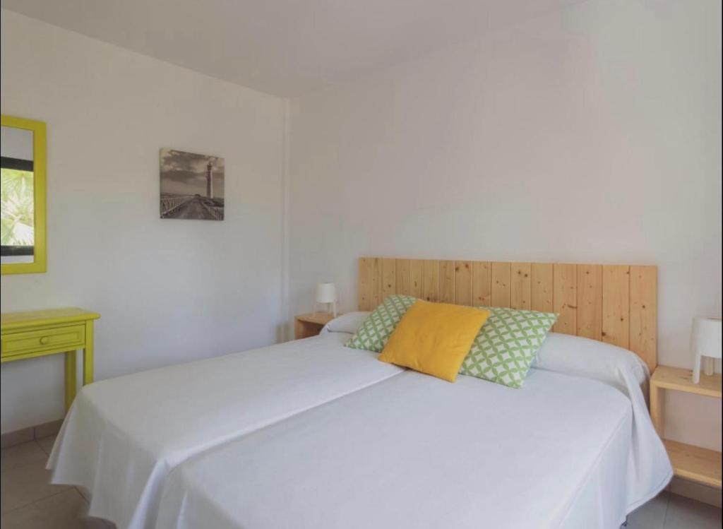 A bed or beds in a room at A paradise in the heart of Corralejo