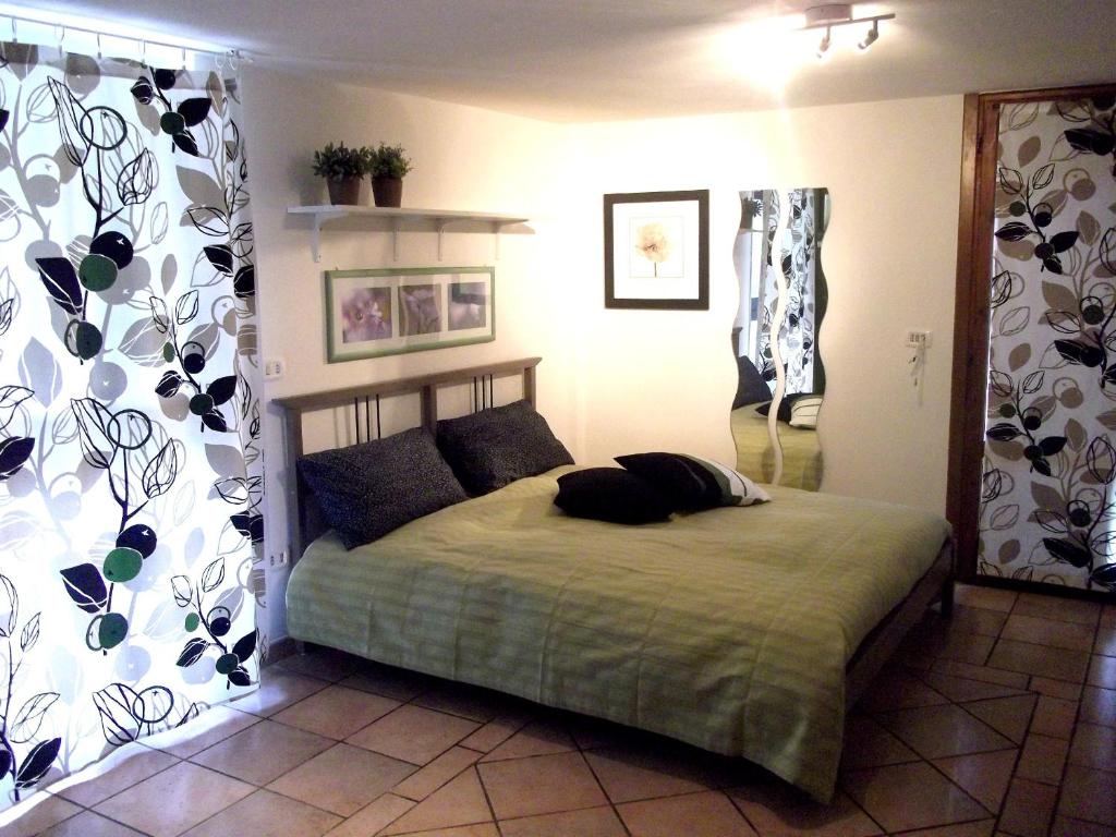 Postel nebo postele na pokoji v ubytování B&B Al Castagneto