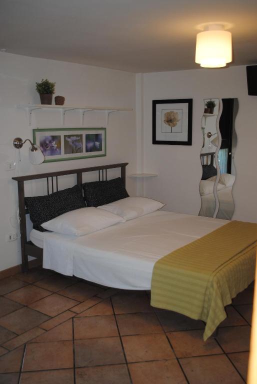Postel nebo postele na pokoji v ubytování B&B Al Castagneto