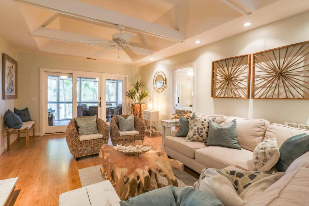 a living room with a couch and a table at Riverhouse in Johns Island