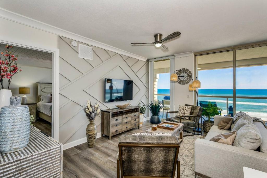 a living room with a view of the ocean at Beach Club 604 in Pensacola Beach