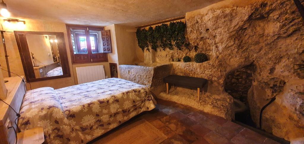 Posteľ alebo postele v izbe v ubytovaní La Cueva de Casa Botes
