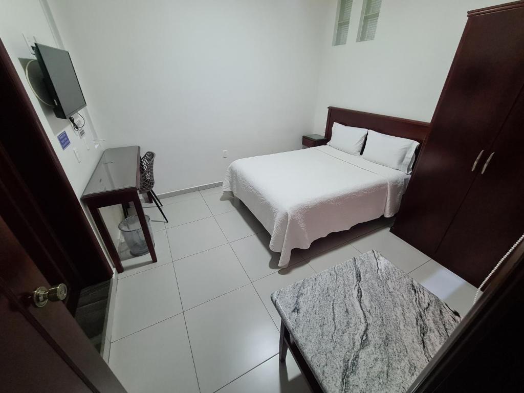 Postel nebo postele na pokoji v ubytování HOTEL FINA INN