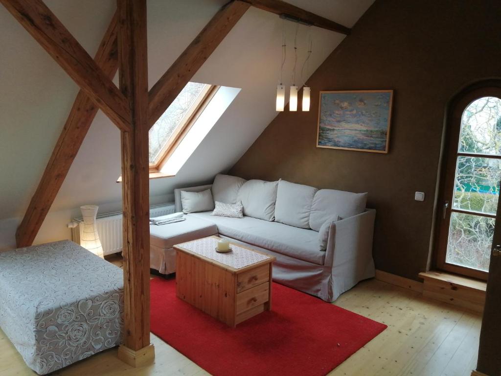 a living room with a couch and a table at Haus Schmeile in Magdeburg