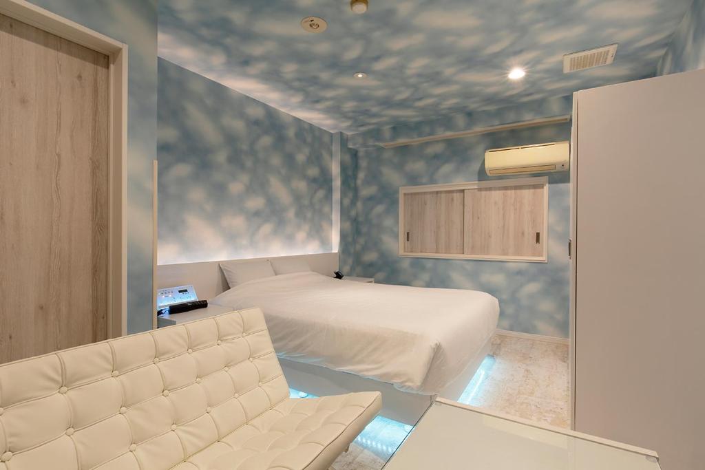 Postel nebo postele na pokoji v ubytování 555MOTEL -NUMAZU-