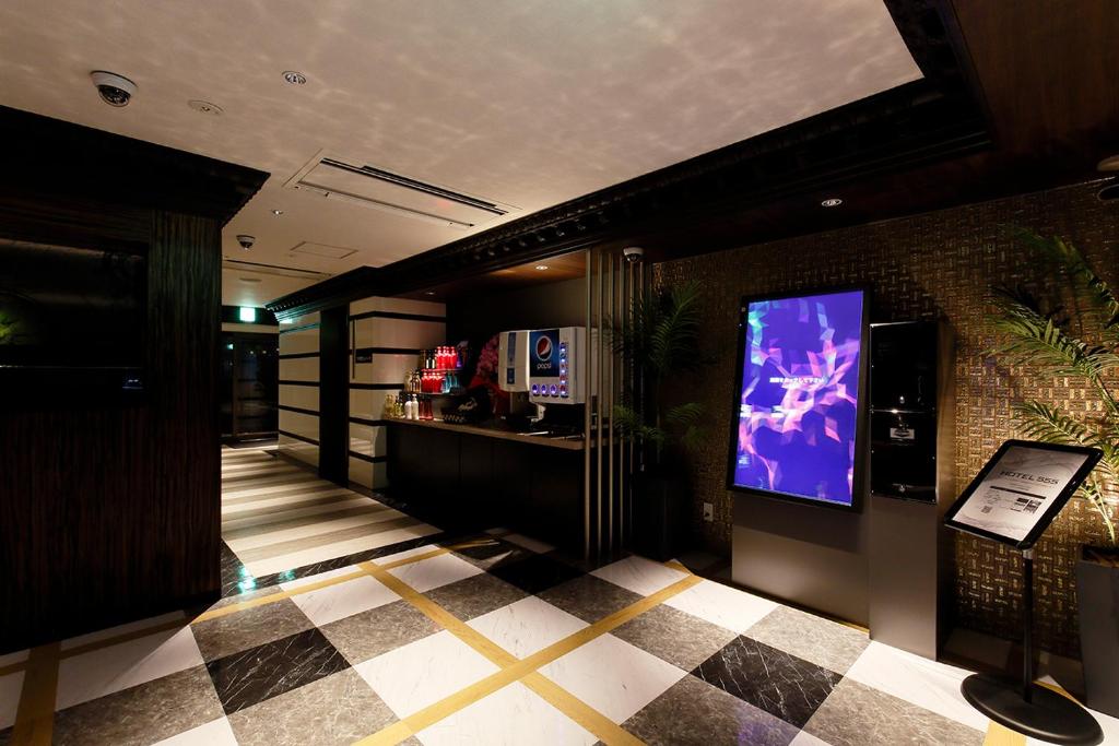 TV a/nebo společenská místnost v ubytování HOTEL555 沼津駅北