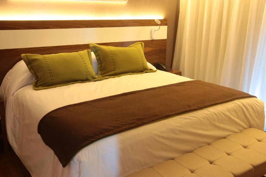 Postel nebo postele na pokoji v ubytování Yrigoyen 111 Hotel