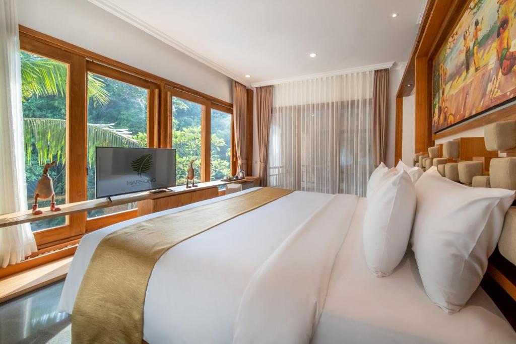 Postel nebo postele na pokoji v ubytování Harsono Boutique Resort Bali