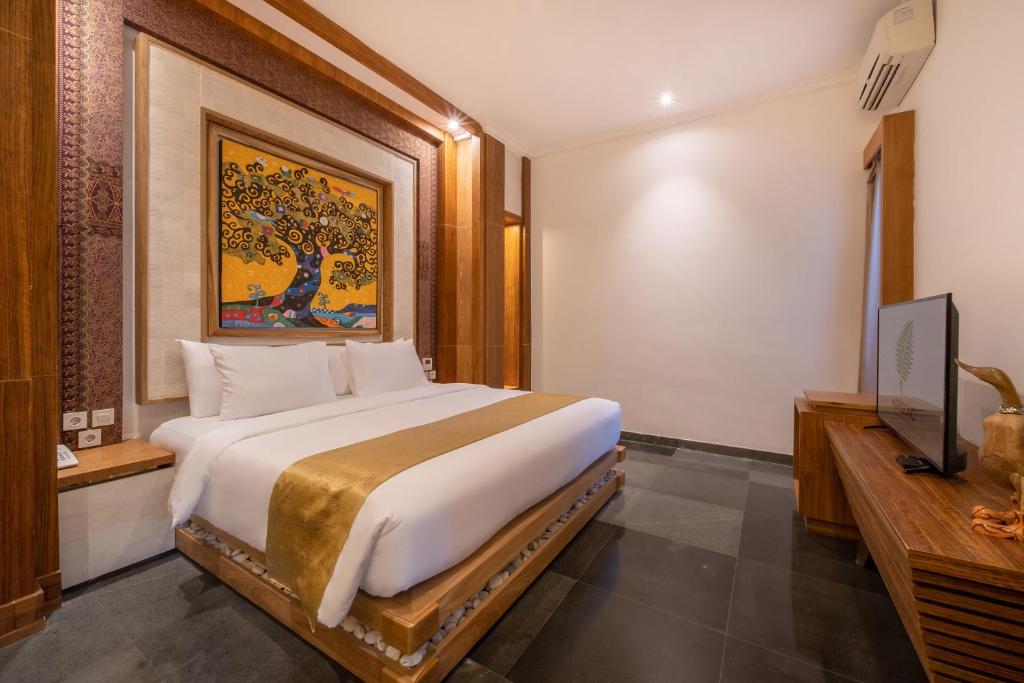 Postel nebo postele na pokoji v ubytování Harsono Boutique Resort Bali