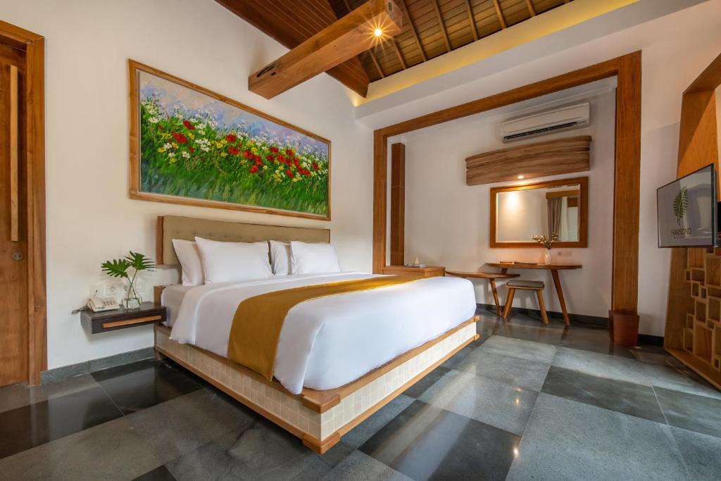 Postel nebo postele na pokoji v ubytování Harsono Boutique Resort Bali