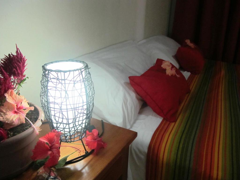Postel nebo postele na pokoji v ubytování Hotel Iguanito