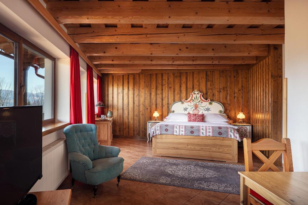 Postel nebo postele na pokoji v ubytování Hotel Křížový vrch