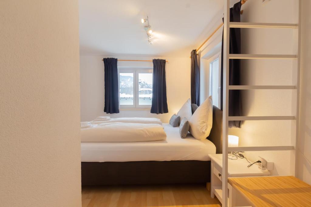 A bed or beds in a room at The Steinbock Lodge with garden and bbq