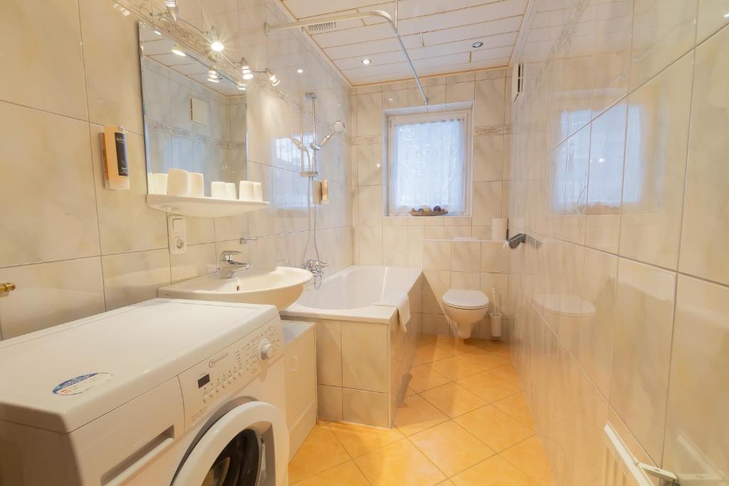 A bathroom at The Steinbock Lodge with garden and bbq