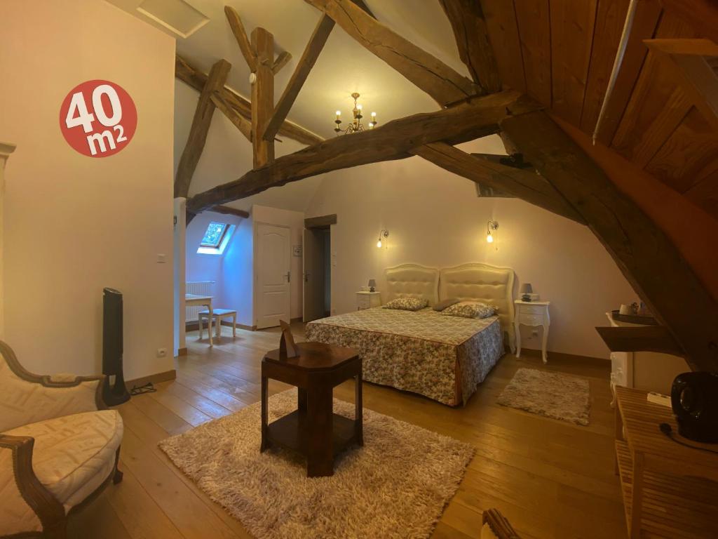Postel nebo postele na pokoji v ubytování Domaine Les Bertrands