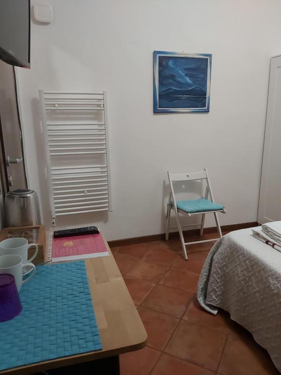 A bed or beds in a room at LODGING 5 TERRE & PORTO LA SPEZIA