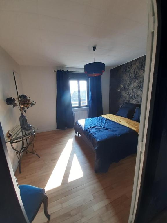 Postel nebo postele na pokoji v ubytování Maison chaleureuse, spacieuse et familiale