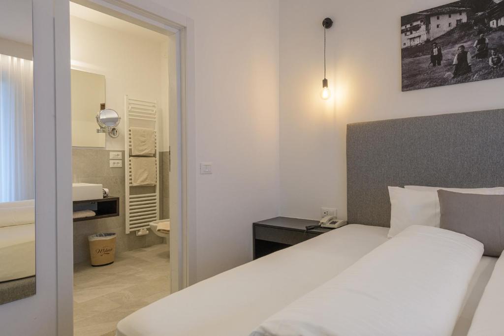 Postel nebo postele na pokoji v ubytování Hotel Wilma