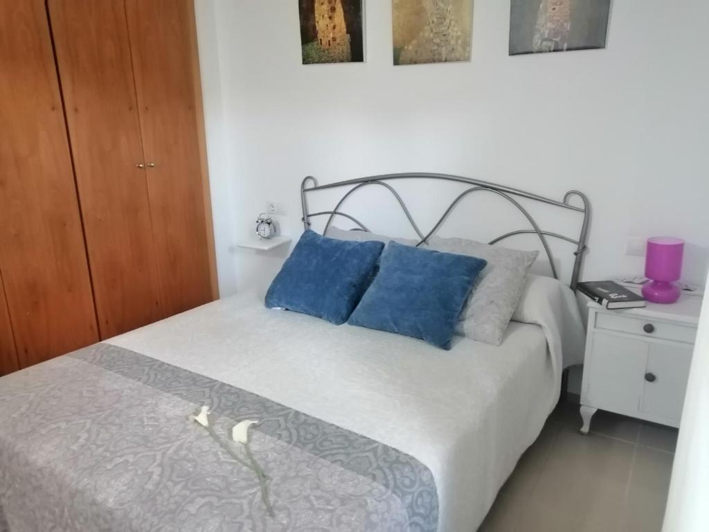 Postel nebo postele na pokoji v ubytování Residencial La Cala